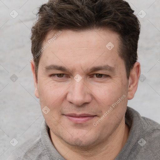 Joyful white adult male with short  brown hair and grey eyes