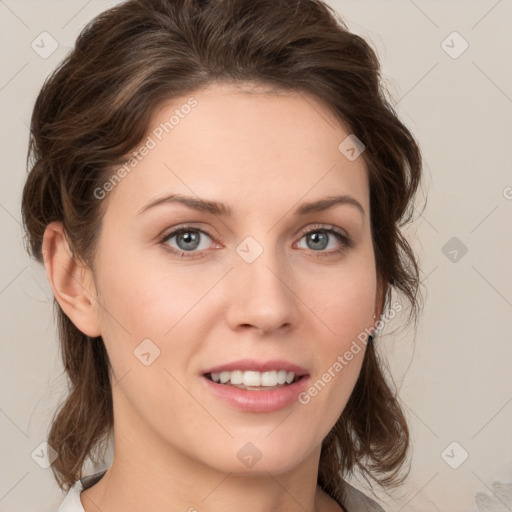 Joyful white young-adult female with medium  brown hair and green eyes