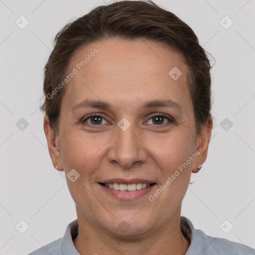 Joyful white adult female with short  brown hair and brown eyes