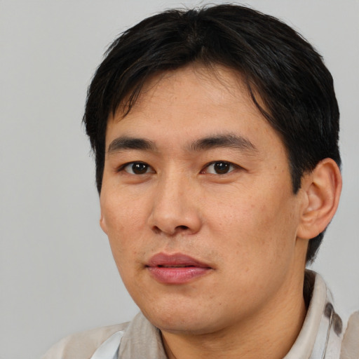 Neutral asian young-adult male with short  brown hair and brown eyes