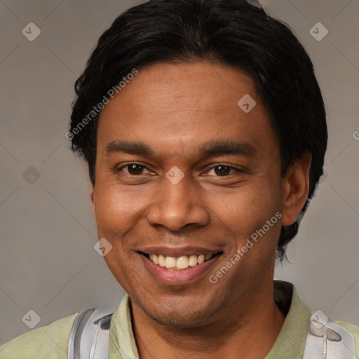 Joyful latino adult male with short  black hair and brown eyes