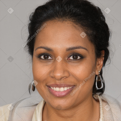 Joyful black young-adult female with medium  brown hair and brown eyes