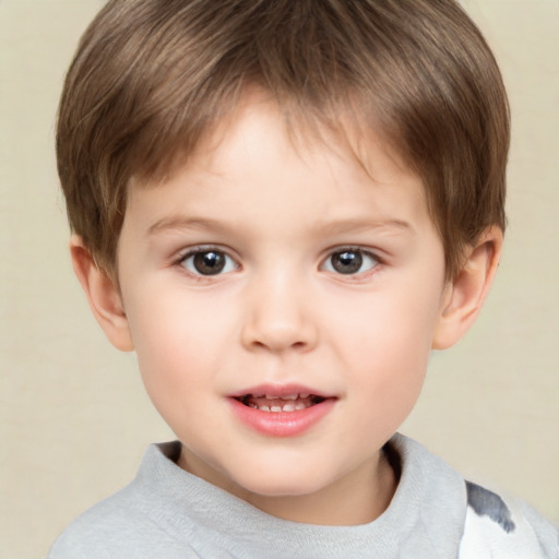 Joyful white child male with short  brown hair and brown eyes