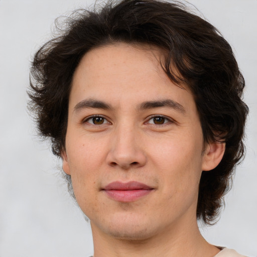 Joyful white young-adult male with medium  brown hair and brown eyes