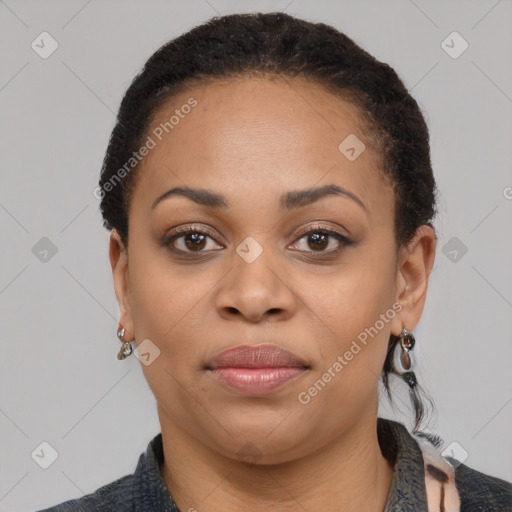 Joyful black young-adult female with medium  black hair and brown eyes