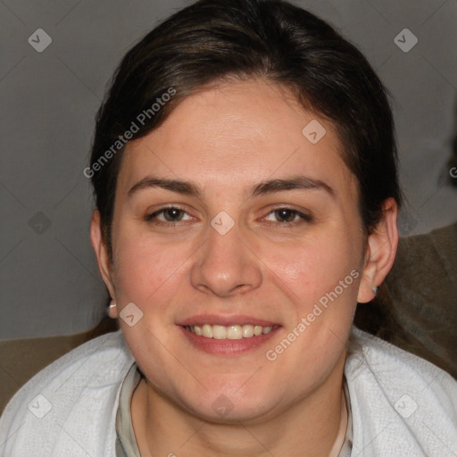 Joyful white adult female with medium  brown hair and brown eyes