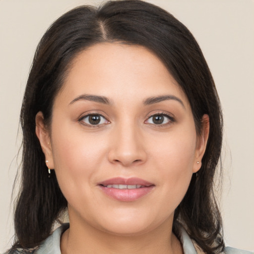 Joyful white young-adult female with medium  brown hair and brown eyes