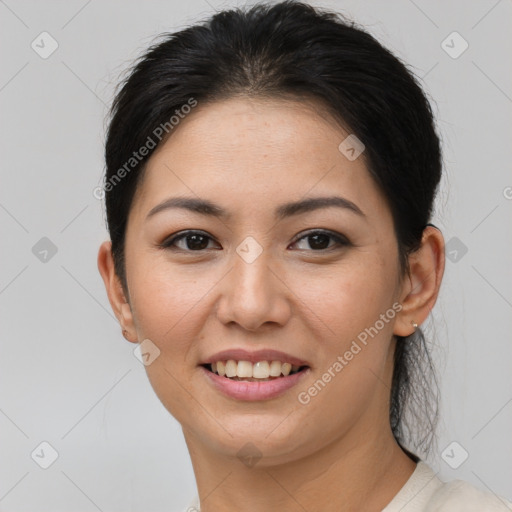 Joyful asian young-adult female with short  brown hair and brown eyes