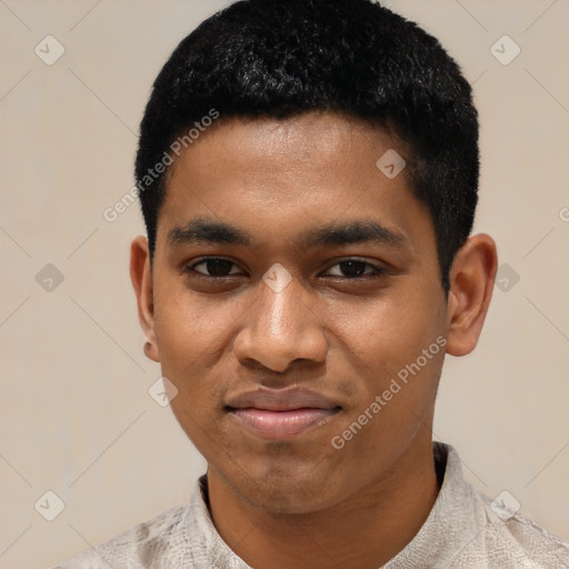 Joyful black young-adult male with short  black hair and brown eyes