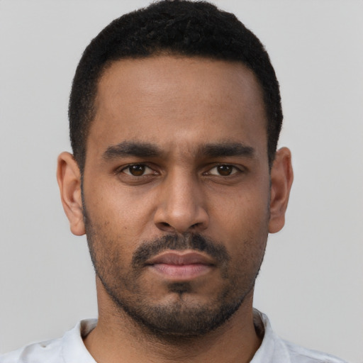 Neutral black young-adult male with short  black hair and brown eyes