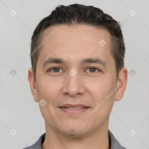 Joyful white adult male with short  brown hair and brown eyes