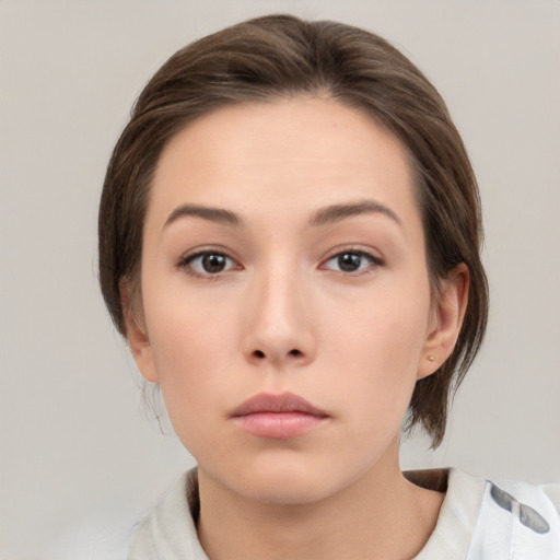 Neutral white young-adult female with medium  brown hair and brown eyes