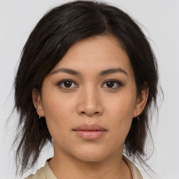 Joyful asian young-adult female with medium  brown hair and brown eyes