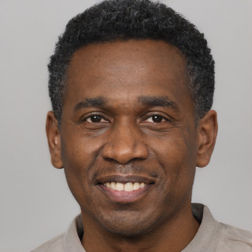 Joyful latino adult male with short  black hair and brown eyes