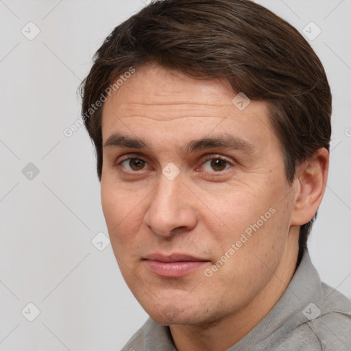 Joyful white adult male with short  brown hair and brown eyes