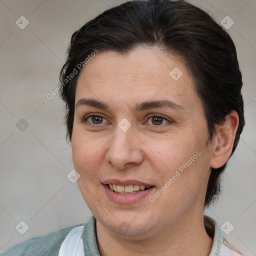 Joyful white adult female with medium  brown hair and brown eyes