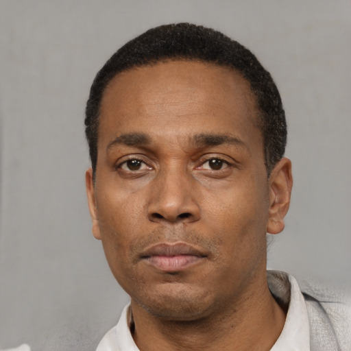 Neutral black adult male with short  black hair and brown eyes