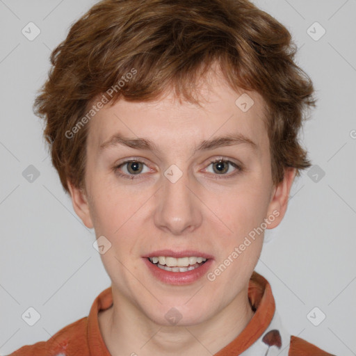 Joyful white young-adult female with short  brown hair and blue eyes