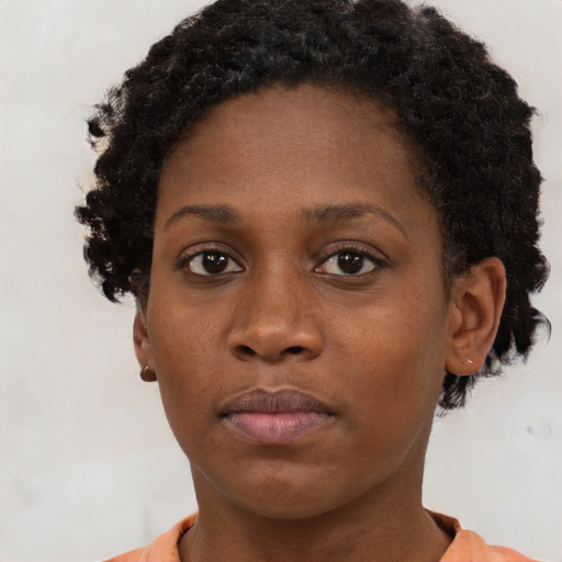 Neutral black young-adult female with short  brown hair and brown eyes