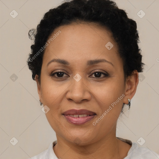 Joyful black adult female with short  brown hair and brown eyes