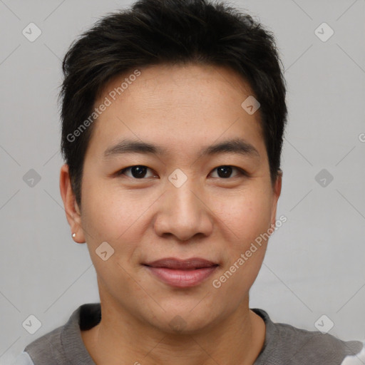 Joyful asian young-adult male with short  brown hair and brown eyes