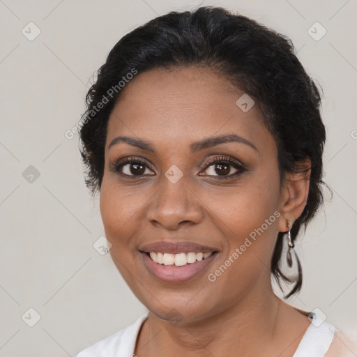 Joyful black young-adult female with medium  brown hair and brown eyes