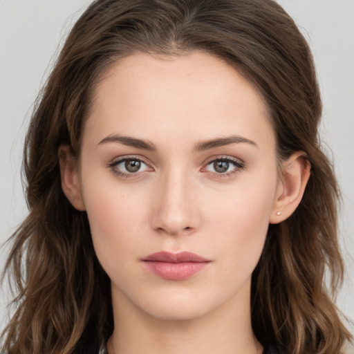 Neutral white young-adult female with long  brown hair and brown eyes