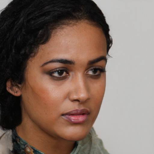 Neutral black young-adult female with long  brown hair and brown eyes