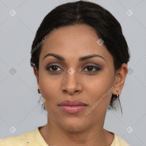 Joyful latino young-adult female with medium  brown hair and brown eyes