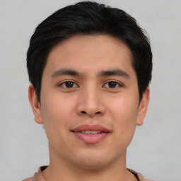 Joyful asian young-adult male with short  brown hair and brown eyes