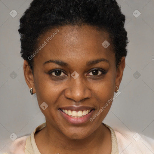 Joyful black young-adult female with short  brown hair and brown eyes