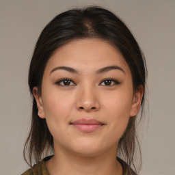 Joyful asian young-adult female with medium  brown hair and brown eyes