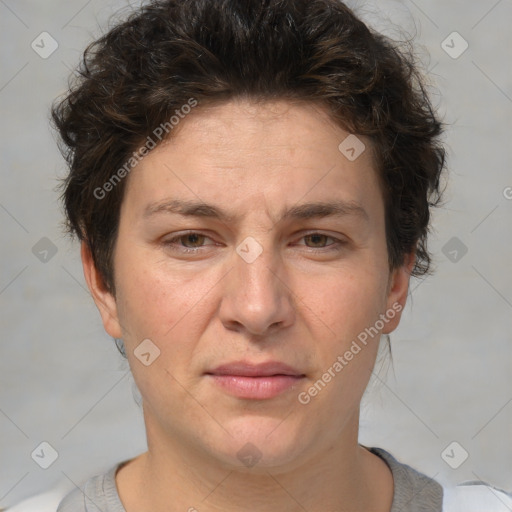 Joyful white adult female with short  brown hair and brown eyes