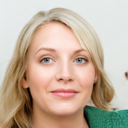 Joyful white young-adult female with medium  brown hair and blue eyes