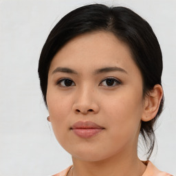 Joyful asian young-adult female with medium  black hair and brown eyes