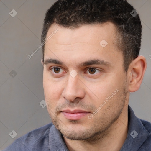 Neutral white young-adult male with short  black hair and brown eyes