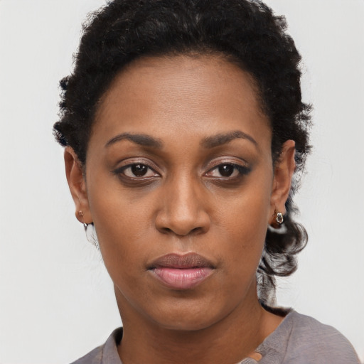 Neutral black young-adult female with short  black hair and brown eyes