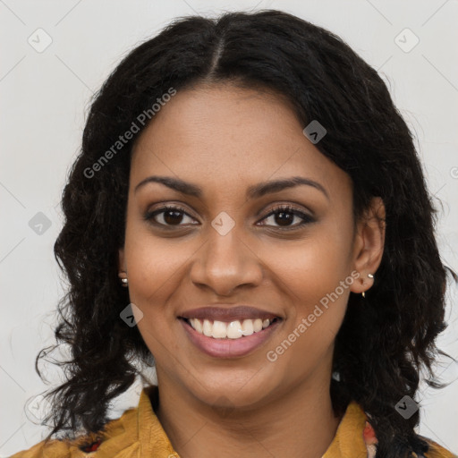 Joyful black young-adult female with long  brown hair and brown eyes