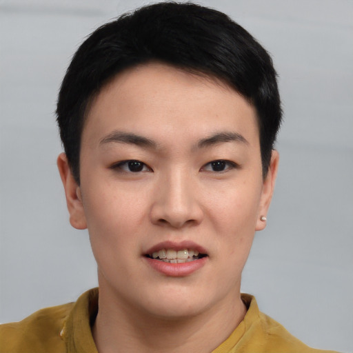 Joyful asian young-adult male with short  black hair and brown eyes