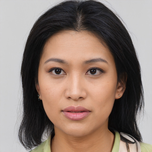 Neutral asian young-adult female with medium  brown hair and brown eyes
