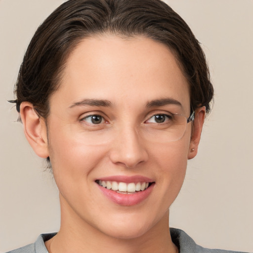 Joyful white young-adult female with short  brown hair and brown eyes