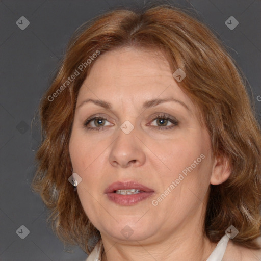 Joyful white adult female with medium  brown hair and brown eyes