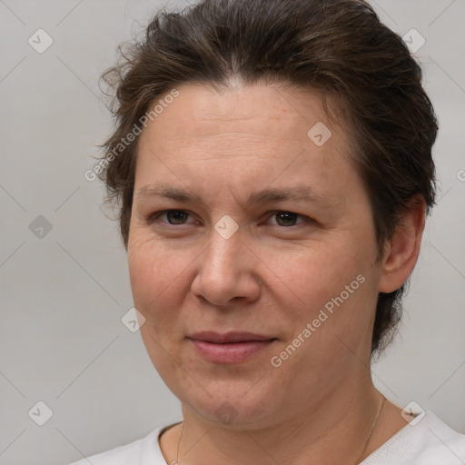 Joyful white adult female with short  brown hair and brown eyes