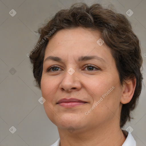 Joyful white adult female with short  brown hair and brown eyes