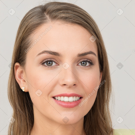 Joyful white young-adult female with long  brown hair and grey eyes