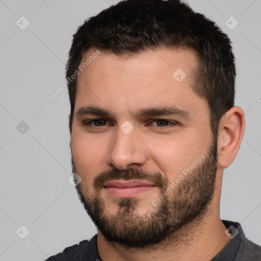 Neutral white young-adult male with short  black hair and brown eyes