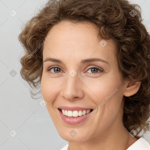 Joyful white young-adult female with medium  brown hair and green eyes