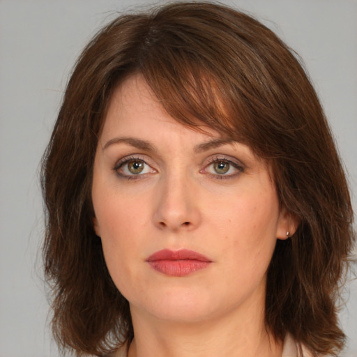 Neutral white young-adult female with medium  brown hair and green eyes