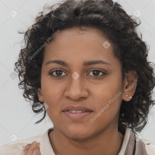 Joyful black young-adult female with long  brown hair and brown eyes