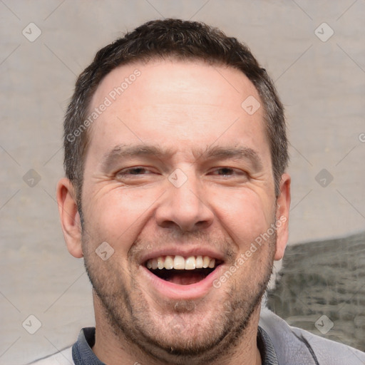 Joyful white adult male with short  brown hair and brown eyes